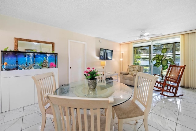 dining room featuring a textured ceiling, ceiling fan, and light tile patterned floors