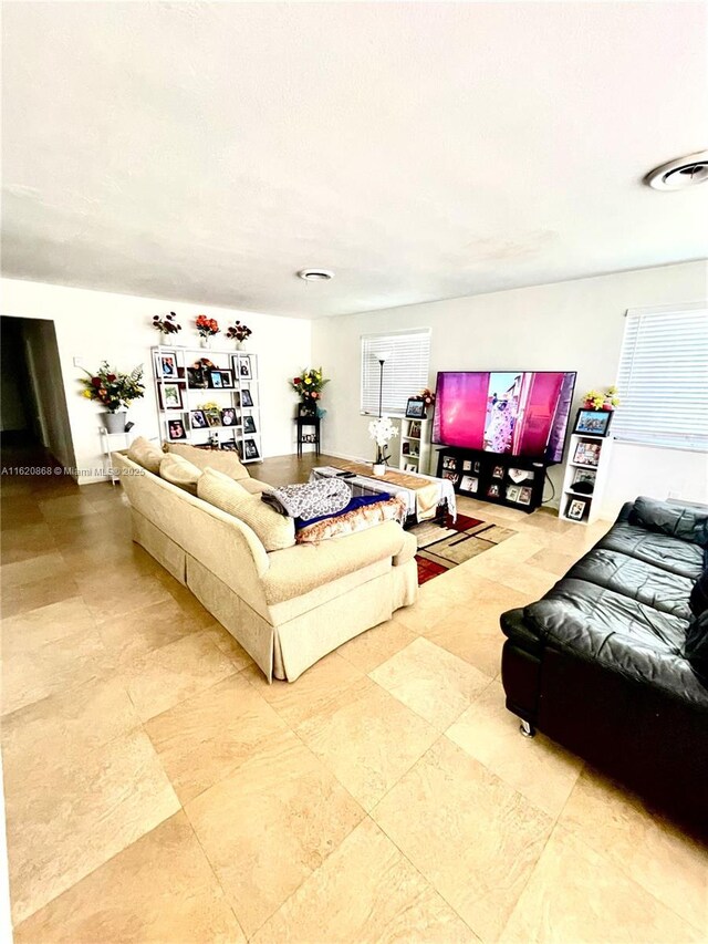 dining room featuring ceiling fan and tile patterned floors