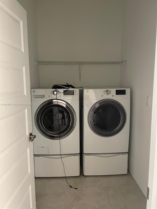 laundry area with washer and clothes dryer