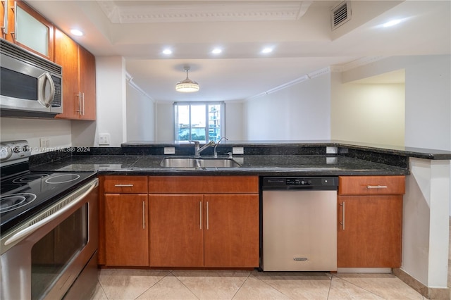 kitchen featuring light tile patterned floors, sink, stainless steel appliances, dark stone countertops, and crown molding