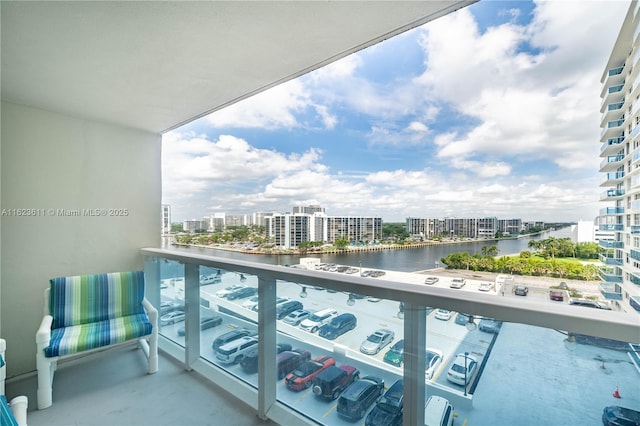 balcony with a water view and a city view
