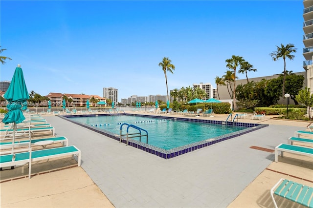 community pool with a patio area