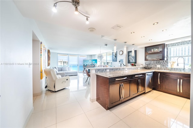 3800 S Ocean Dr Unit 1512A, Hollywood, FL 33019 - kitchen with a sink, dishwasher, open floor plan, dark brown cabinets, and a peninsula