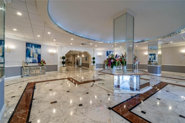 3800 S Ocean Dr Unit 1512A, Hollywood, FL 33019 - community lobby featuring recessed lighting, crown molding, and a wainscoted wall