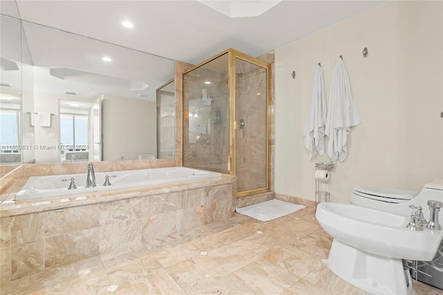 bathroom featuring a bidet, separate shower and tub, and toilet