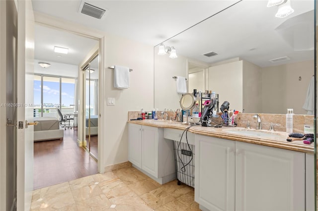 bathroom featuring wood-type flooring and vanity