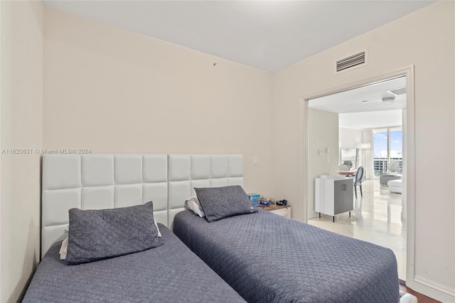 bedroom featuring floor to ceiling windows