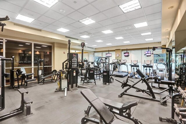 workout area with a paneled ceiling