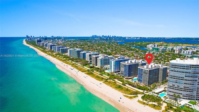 aerial view featuring a view of the beach and a water view