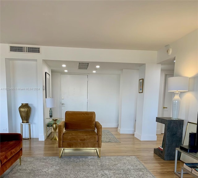 living area with light hardwood / wood-style floors