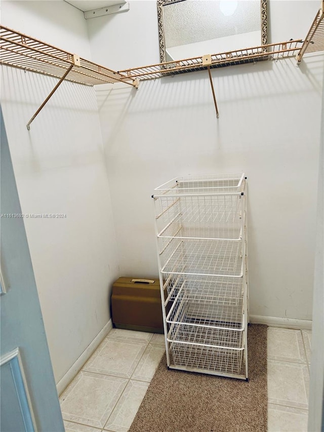 spacious closet featuring tile patterned floors