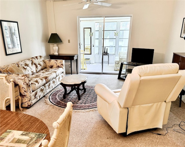 living room featuring carpet floors and ceiling fan