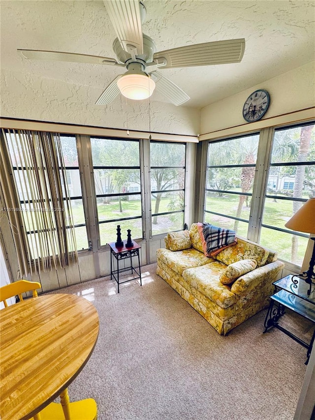 sunroom with ceiling fan and a wealth of natural light