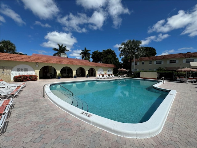 view of swimming pool with a patio