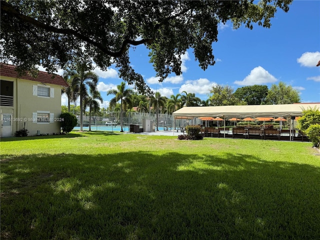 view of yard with a fenced in pool