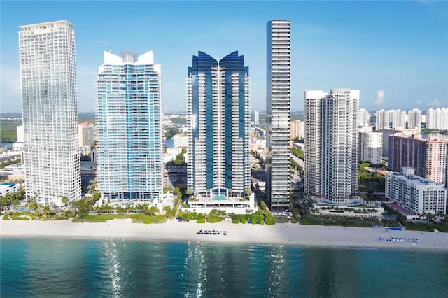 view of city featuring a view of the beach and a water view