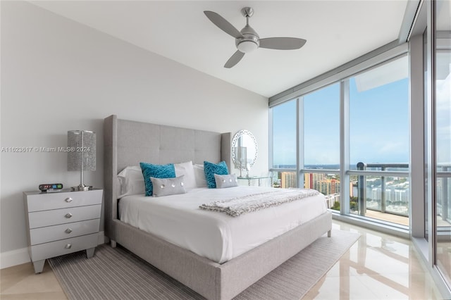 tiled bedroom featuring floor to ceiling windows and ceiling fan