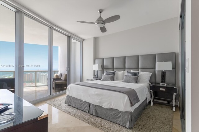 bedroom featuring tile patterned floors, ceiling fan, and access to exterior