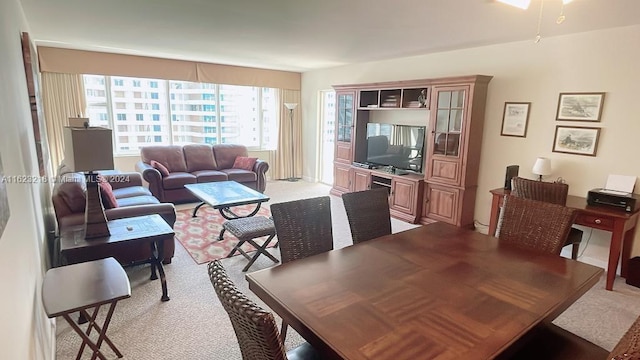 dining space with light carpet