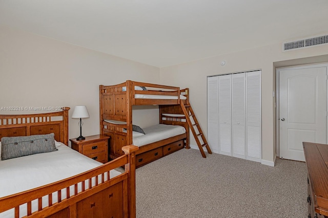 carpeted bedroom featuring a closet