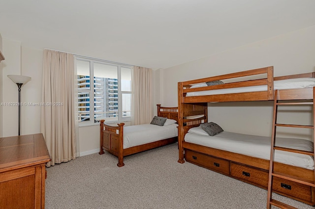 bedroom featuring light colored carpet