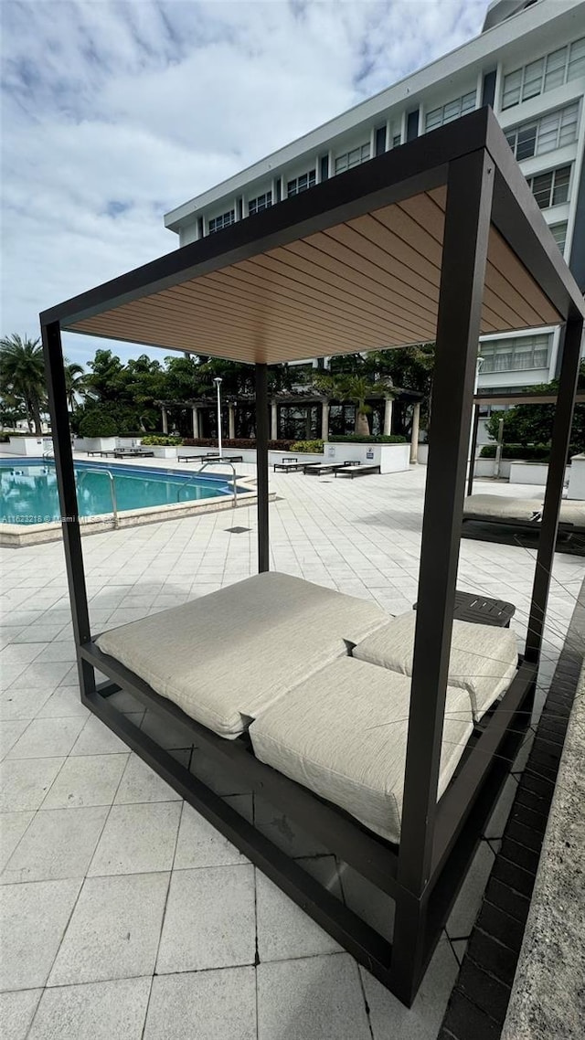 view of swimming pool featuring a patio area