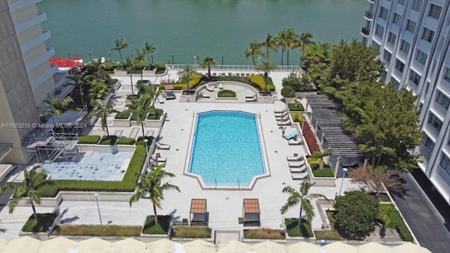 birds eye view of property with a water view