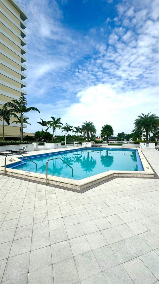 view of pool featuring a patio area