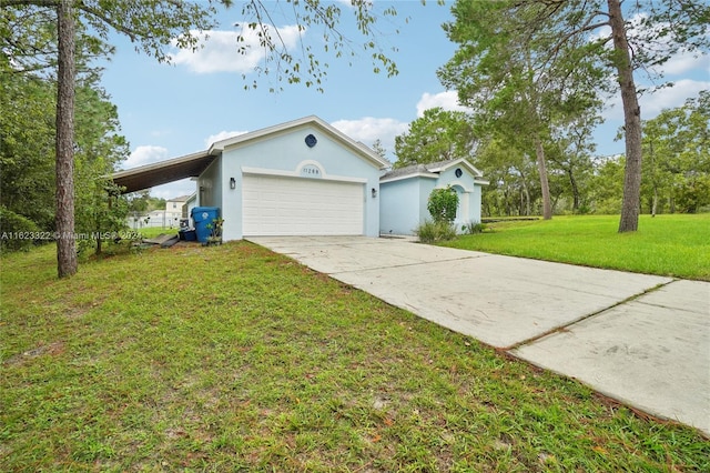 view of front of house with a garage, a front lawn, and a carport