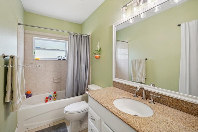 full bathroom with shower / bath combo, vanity, and toilet