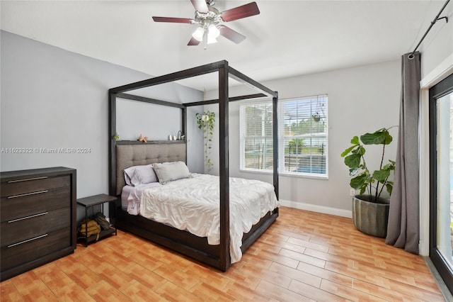 bedroom with ceiling fan and light hardwood / wood-style flooring