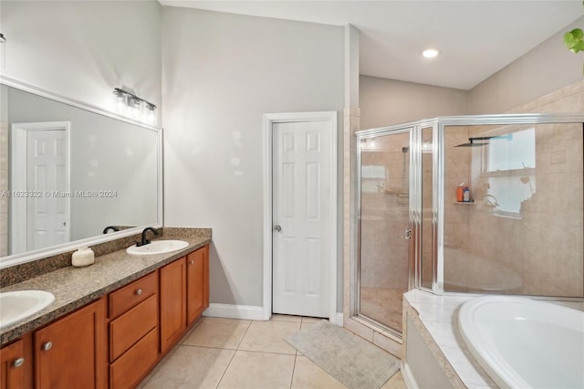 bathroom with vanity, tile patterned floors, separate shower and tub, and lofted ceiling