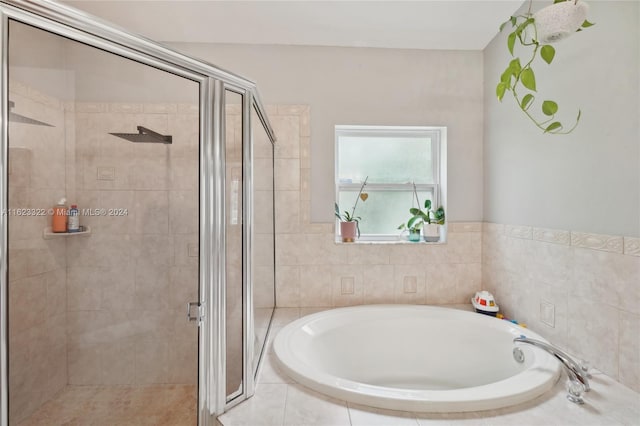 bathroom featuring separate shower and tub