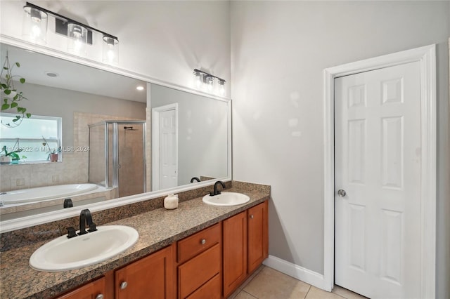 bathroom featuring vanity, tile patterned floors, and plus walk in shower