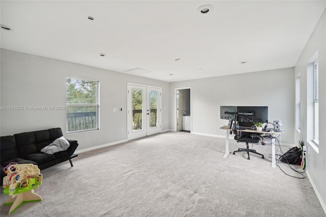 home office with french doors and light colored carpet