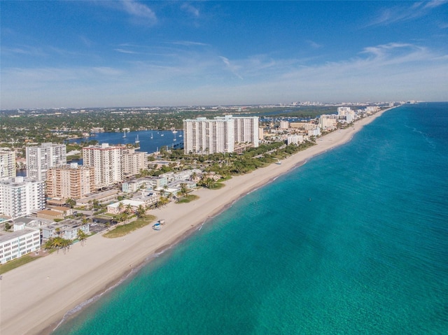 drone / aerial view with a view of city, a beach view, and a water view