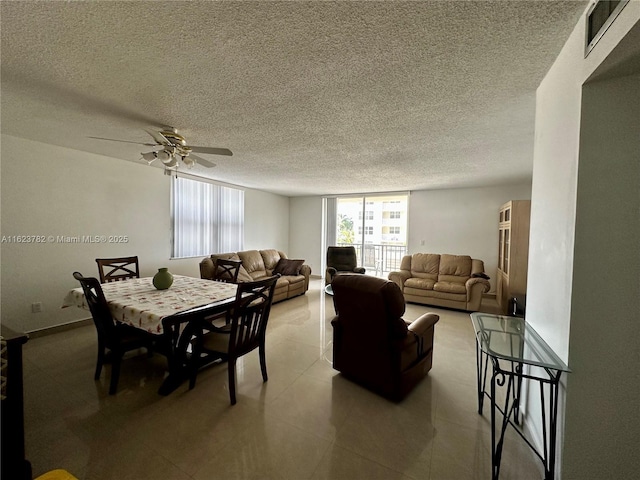 dining room with a ceiling fan, visible vents, a textured ceiling, and light tile patterned floors