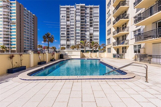 view of swimming pool featuring a patio