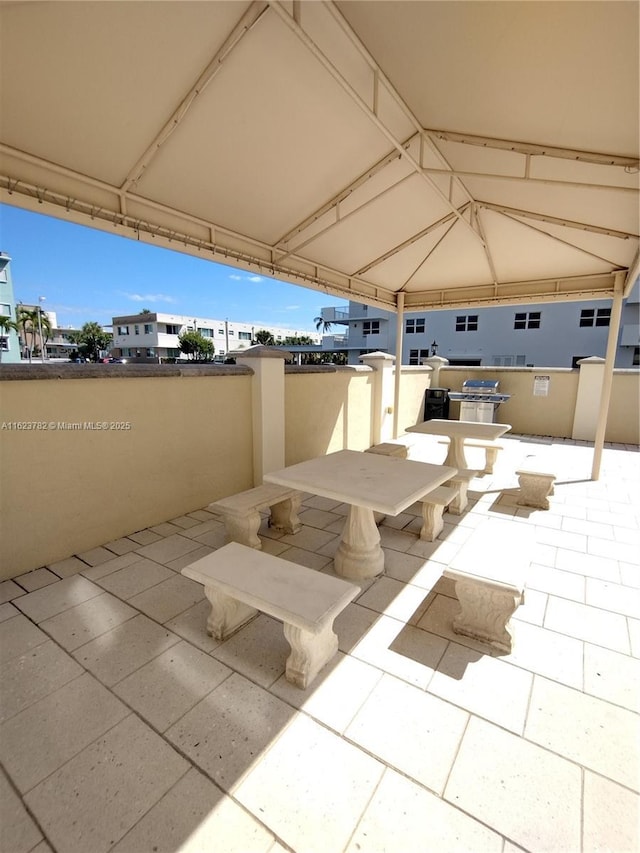 view of patio featuring outdoor dining space and visible vents