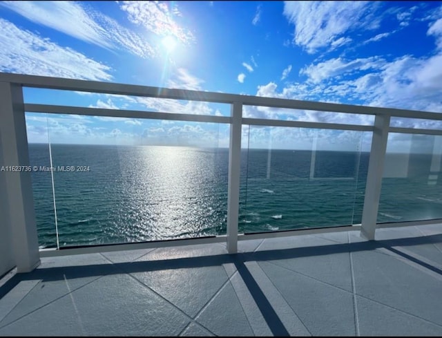 balcony featuring a water view