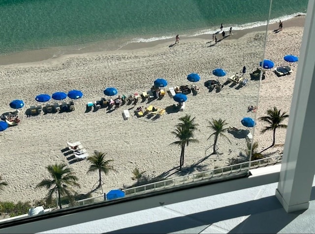 aerial view featuring a water view and a view of the beach