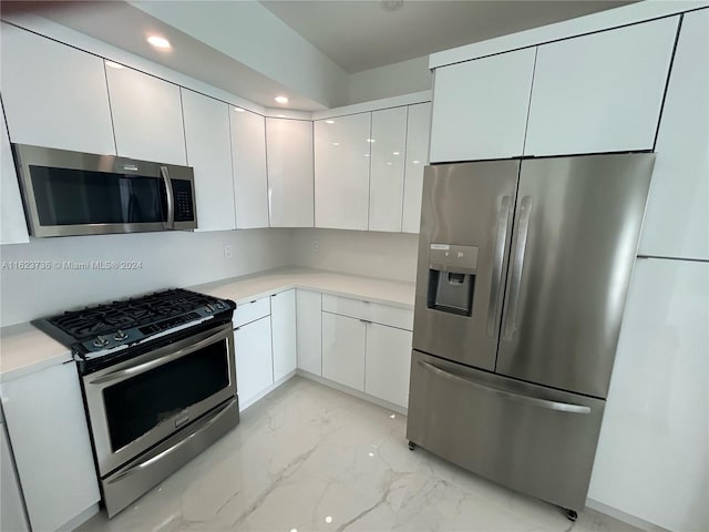 2030 S Ocean Dr Unit 2220, Hallandale Beach, FL 33009 - kitchen with appliances with stainless steel finishes, light marble finish flooring, white cabinetry, light countertops, and recessed lighting