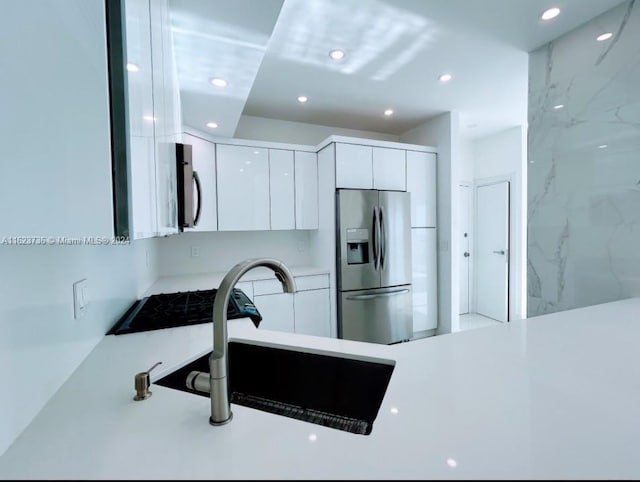 2030 S Ocean Dr Unit 2220, Hallandale Beach, FL 33009 - kitchen with stainless steel refrigerator with ice dispenser, modern cabinets, white cabinets, recessed lighting, and light countertops