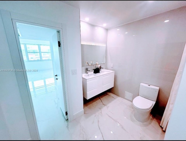 2030 S Ocean Dr Unit 2220, Hallandale Beach, FL 33009 - bathroom with marble look tile flooring, double vanity, toilet, and recessed lighting