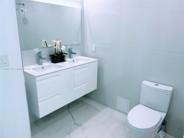 2030 S Ocean Dr Unit 2220, Hallandale Beach, FL 33009 - bathroom featuring double vanity, toilet, and marble look tile flooring
