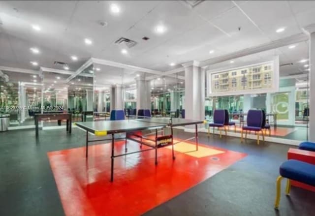 game room with ornate columns