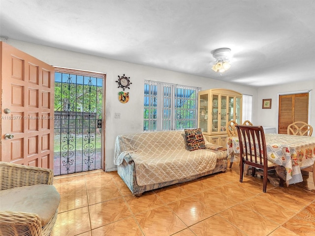 interior space featuring access to outside and ceiling fan