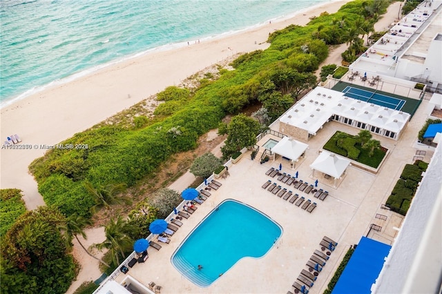 bird's eye view with a water view and a view of the beach