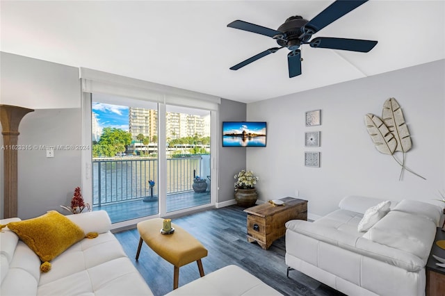 living room featuring dark hardwood / wood-style floors and ceiling fan