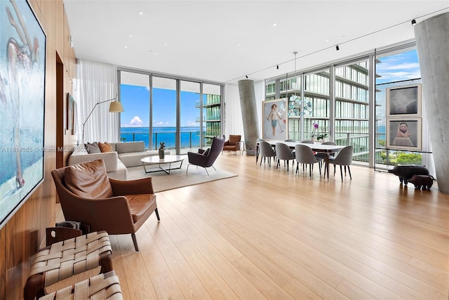 sunroom / solarium with a water view